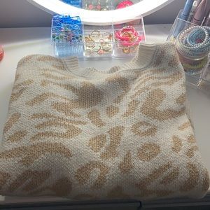 beige and white sweater